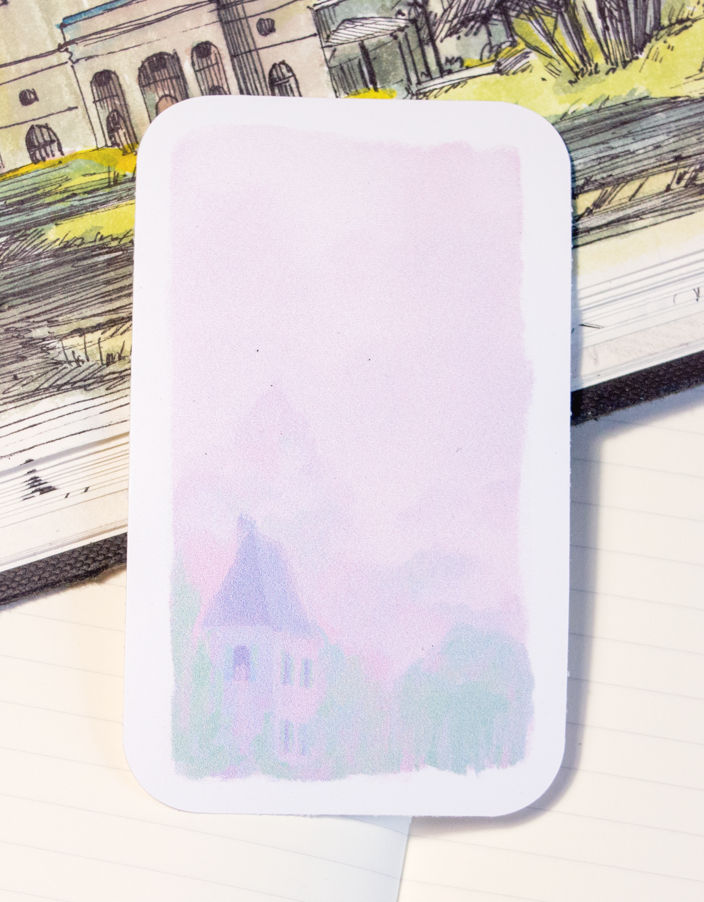 Sticker of a pastel manor between powdery hills.