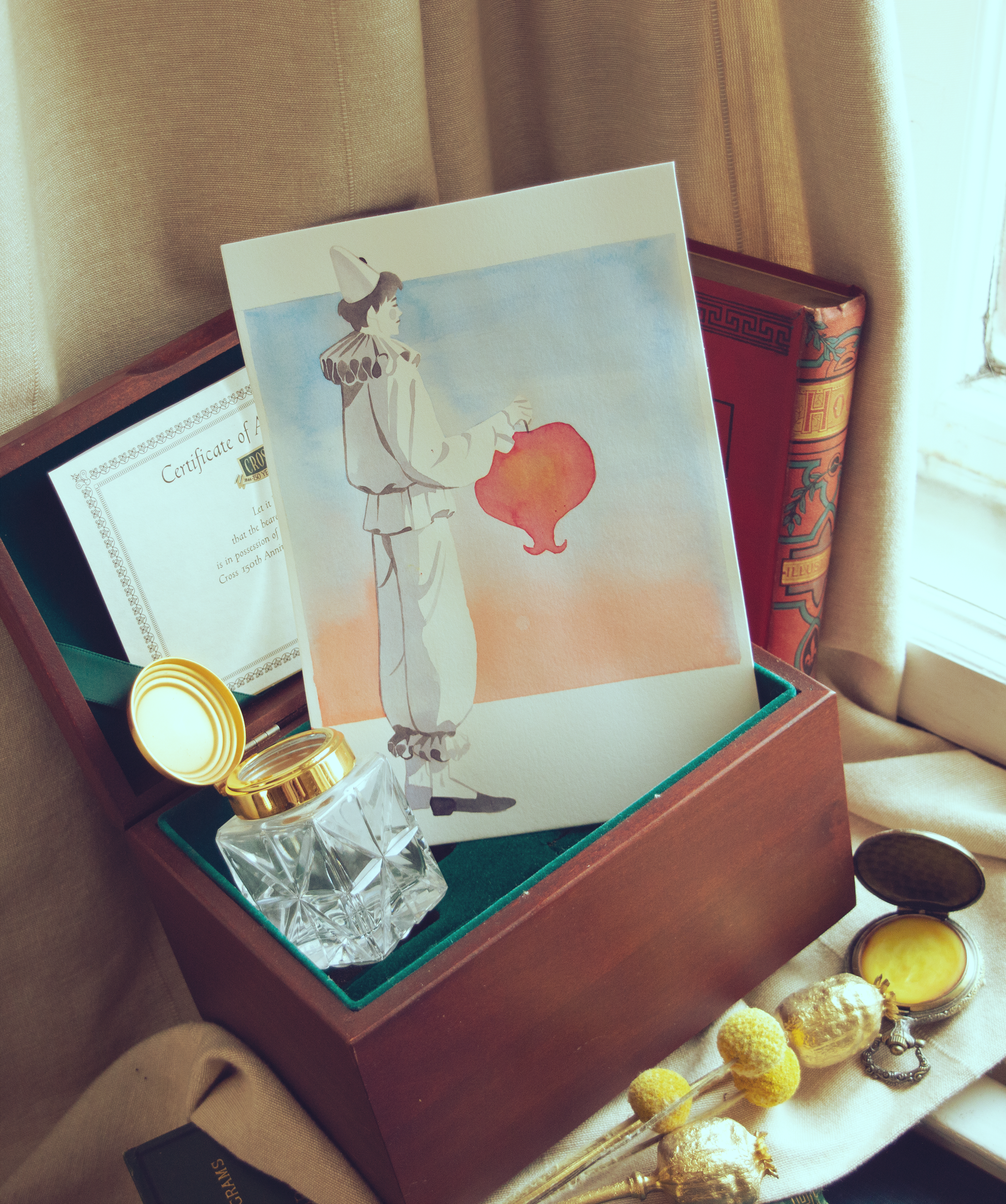 Vince in a pierrot costume holding a lantern. This illustration is an original art work make with ink on paper, starring the main characters of the webcomic Little Starling by Pearl See.