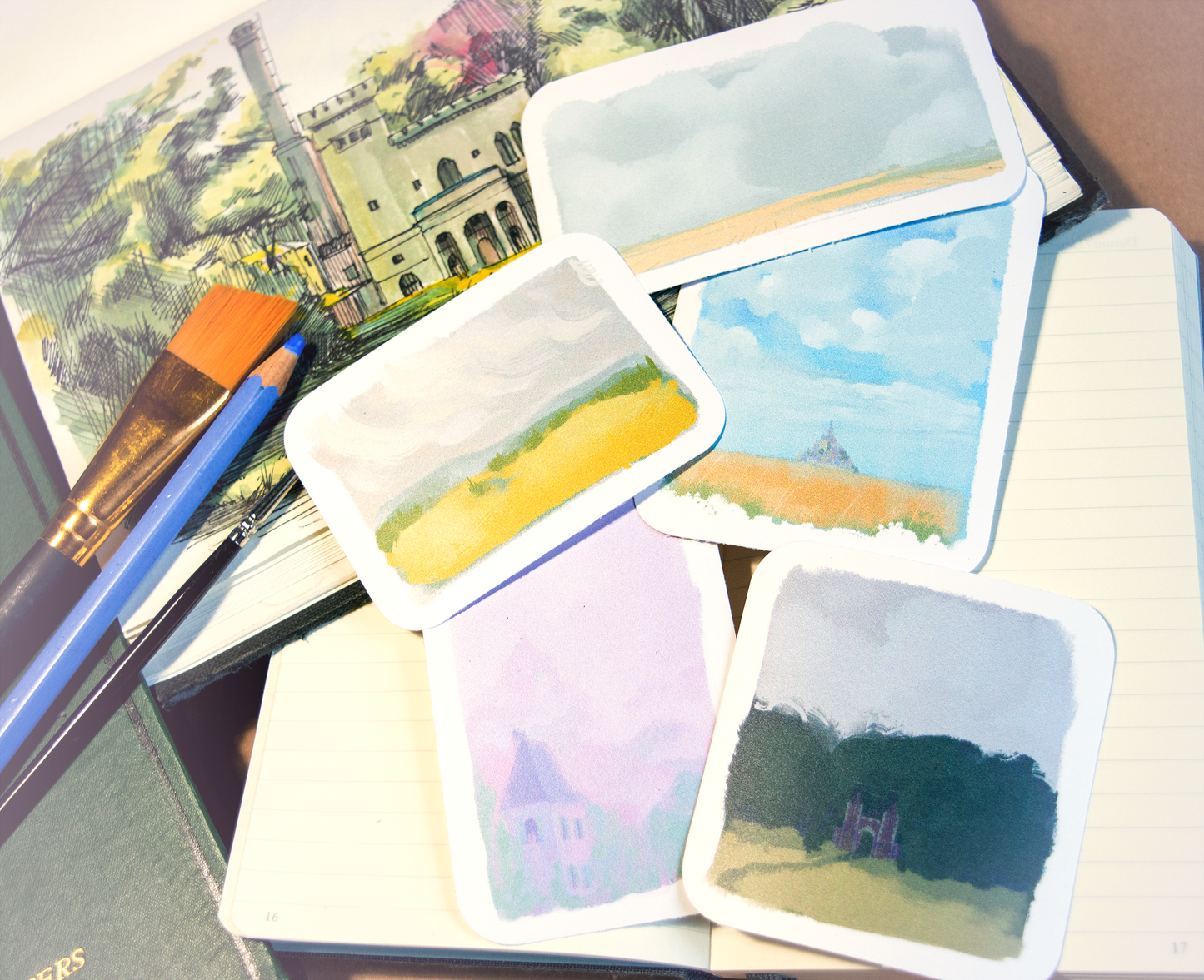 Five small stickers of the moody landscapes of the Bretagne. Fields, clouds, castles and Mont-Saint-Michelle.