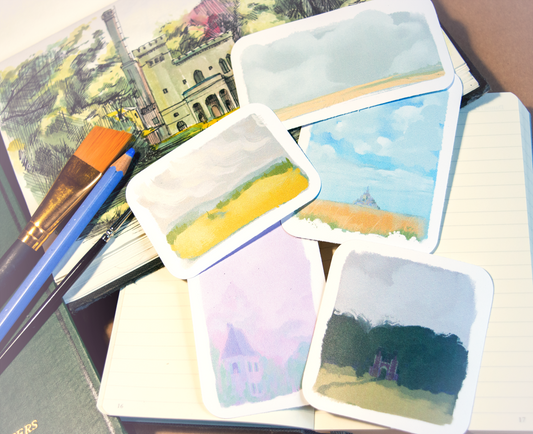 Five small stickers of the moody landscapes of the Bretagne. Fields, clouds, castles and Mont-Saint-Michelle.
